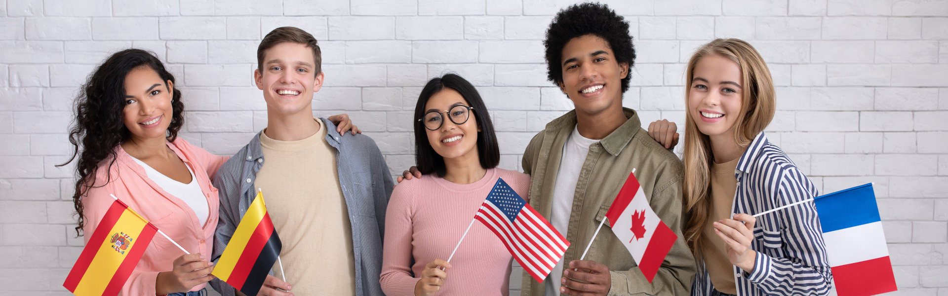 young men and women with flags smiling